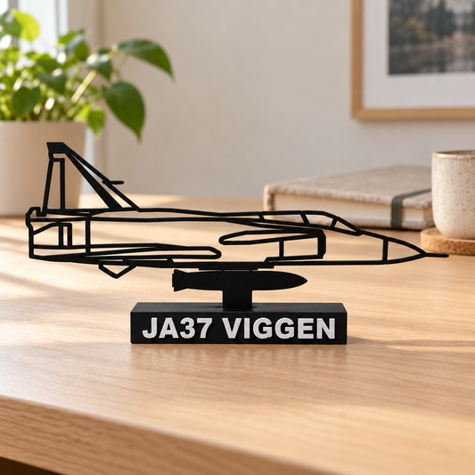 Rendered lifestyle preview of the enlarged and reinforced JA37 Viggen side-profile model on an oak home-office desk