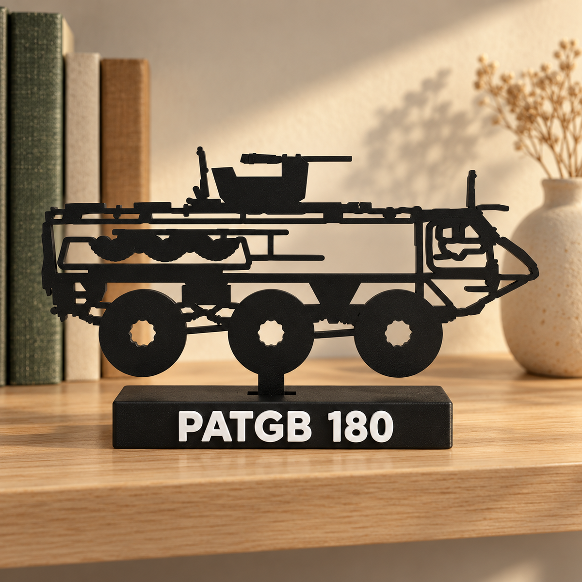 Lifestyle preview of the Swedish PATGB 180 silhouette display model on a collector's bookshelf beside muted books and a ceramic vase.