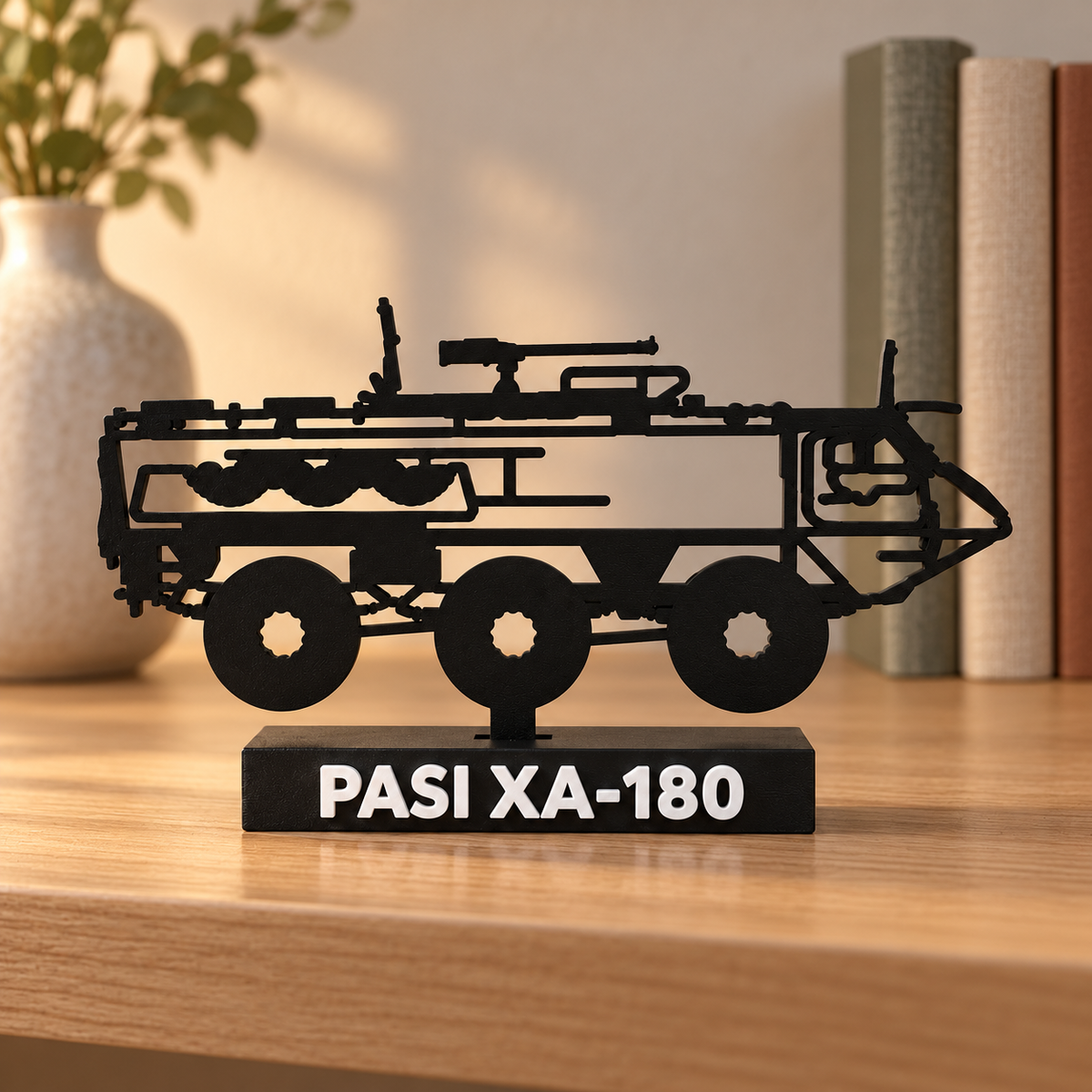 Lifestyle preview of the Finnish PASI XA-180 silhouette display model on a bookshelf beside books and a ceramic vase.