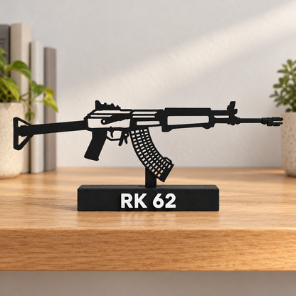 Digital lifestyle preview on an oak shelf of the updated RK 62 decorative silhouette model, with reinforced open detail lines, matte black finish and labelled display base.