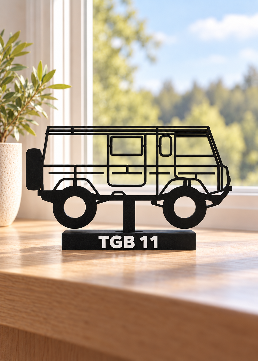 Digital preview of the updated TGB 11 Hilbert silhouette display model, window-side home-office lifestyle.